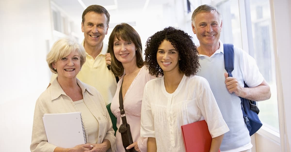 Group of People Posing for Picture in Building