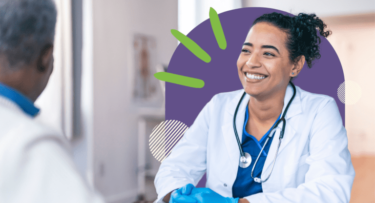 female physician smiling, wearing stethoscope and gloves, talking with another physician