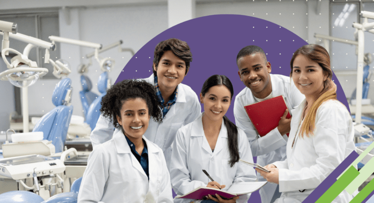 five dental students holding folders smiling