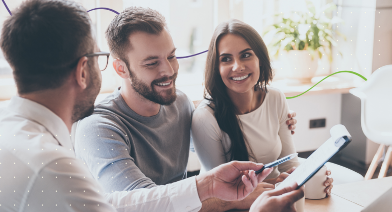 man and woman looking at paperwork talking to insurance agent about disability insurance