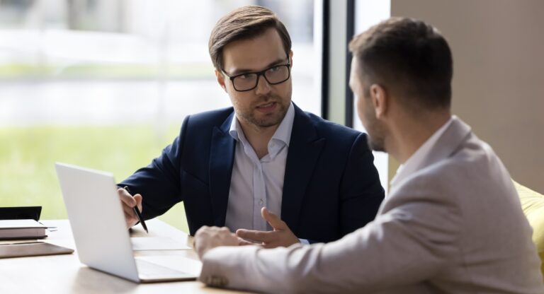 disability insurance specialist explaining policy coverage to man