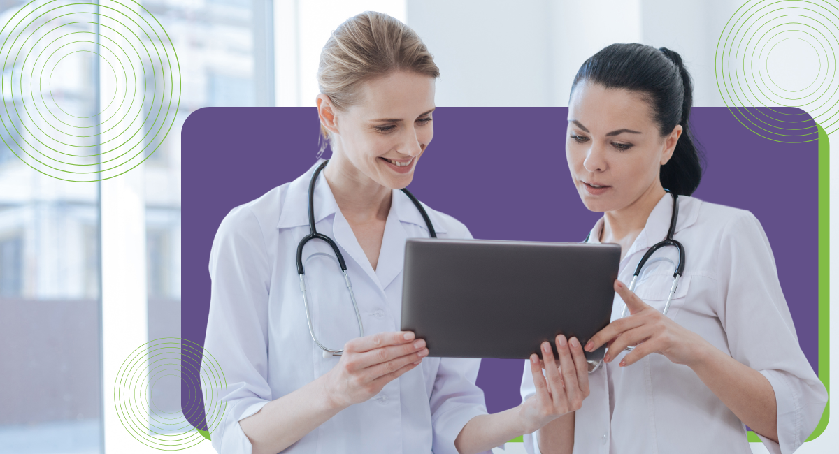 Two female doctors looking at a medical chart