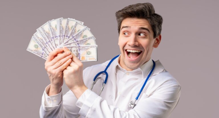 Doctor holding a large amount of US cash in his hand